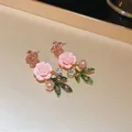 Detail view of vintage pink fabric rose earrings with pearls and crystals. - Pink Rose Earrings (925 Sterling Silver Earring Post)