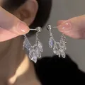 Close-up of elegant silver needle drop earrings with sparkling marquise-cut crystals - Marquise Rhinestone Tassel Dangle Style (5253742939752)