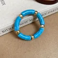 Acrylic blue marble tube bracelet with golden spacers, detail view - Blue Marble Pattern Segment Bracelet / Sky Blue