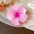 Detailed view of the elegant dopamine pink flower hair claw clip with its pleated stripe texture - Pink