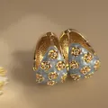 Elegant vintage C-shaped hoop earrings with light blue enamel and tiny gold flower details - C-Shaped Ear Cuff / Gold-Blue