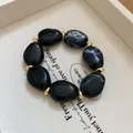 Statement black and marbled grey acrylic chunky bracelet with decorative gold spacers - Style 45 Red Floral