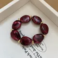 Vintage burgundy marbled acrylic bead bracelet with elegant gold spacers for a stylish look - Style 46 Black Floral