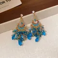 Eleganti orecchini color oro con frange in cristallo blu e accenti di zirconi colorati - Stile Nappa Chandelier Bohémien / Blu (84# Perno in Argento Sterling 925)