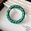 Elegant green leopard print acrylic beaded bracelet featuring a unique golden metal accent bead - Style 55 Navy Orange Floral