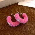 Detailed view of pink fuzzy fur ball hoop earrings featuring silver snowflake charms. - Pink C-shaped Plush Snowflake Earrings (3# Silver Pin-Pink)