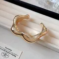 Elegante brazalete dorado irregular con diseño de ondas y acabado pulido brillante - Estilo De Onda De Lava Irregular (35#) / Dorado