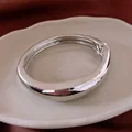 Brazalete minimalista de metal plateado grueso con acabado pulido elegante para mujer - Estilo Irregular Aerodinámico Plateado (78#) / Plateado