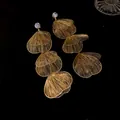 Detailed view of gold tiered fan-shaped wire earrings with rhinestone studs - Petal Tassel Style / Gold