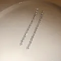 Detail view of sparkling square-cut cubic zirconia long tassel earrings - Silver