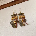 Orecchini pendenti etnici boho con perline in legno e ciondoli a foglia color bronzo - Stile Gancio per Orecchio Acchiappasogni a Foglia (70#) / Oro Antico