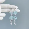 Detailed view of delicate blue floral tassel earrings with clear crystal accents on silver. - Silver Style (23#)