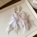 Exquisite close-up of bohemian style feather tassel earrings with natural stone detail. - Feather Tassel Style (HE23665) / Gold Brown