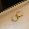 Minimalist golden twisted hoop earrings with a stylish design and premium silver needle - 3cm / Mobius Twist / Gold