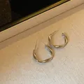 Minimalist silver twisted hoop earrings with a sleek modern design for everyday wear. - 3cm / Mobius Twist / Silver