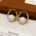 Detailed view of 18k gold plated hoop earrings featuring elegant white pearls - Gold-White (Real Gold Plated)