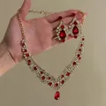 Detail view of gold-tone vintage necklace and earrings set with red teardrop stones - Lace Cluster Jewelry Set (2#) / Gold-Red