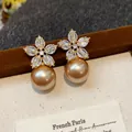 Detailed view of champagne pearl drop earrings with sparkling zirconia flowers - Flower Large Pearl Style (55#)