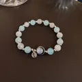 Handmade blue and white cat-eye stone beaded bracelet with elegant silver charm detail - Round Bead Charm Style (26#)
