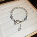 Elegant handmade cat's eye stone beaded bracelet with star charm on a white jewelry tray - Star Charm Style (50#)