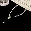 Detailed view of an elegant silver beaded necklace featuring pearls and a heart pendant - Heart Pendant Splattered Silver Splicing Style (Style 5) / Silver
