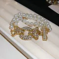 Bracelet en perles double rang avec un fermoir doré serti de strass brillants pour femme - Double Layer Buckle Zirconia Style (46#) / Blanc-Or