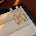 Eleganti orecchini geometrici pendenti dorati con zirconi scintillanti per donna - Stile Goccia Pavé Oro