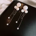Detailed view of elegant baroque pearl earrings with zircon and long gold tassels - 26# Drop