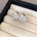 Close-up of silver rippled teardrop stud earrings with textured finish in a jewelry box. - Polished Wrinkled Drop (10)