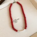 Elegant red agate beaded clavicle necklace featuring a matte silver curved tube accent - Style 24 - Ankola Red