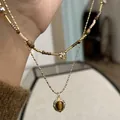 Collier style ethnique vintage avec pendentif ovale en œil de tigre et perles dorées - 34# Collier (Plaqué Or 14K) / Or avec Café