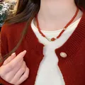 Elegant red agate bead necklace featuring a Ping An Kou charm worn by a female model - 5# Necklace - Red