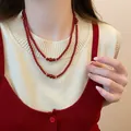 Elegant double-layered red agate beaded necklace with gold accents worn by a model - #4 Necklace - Necklace - Red