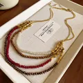 Elegant multi-layer beaded necklace with gold, red, and bronze faceted beads. - Necklace #12 - Red - Brown