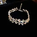 Detailed macro view of a double-layer silver choker with irregular oval rhinestones - Bracelet / Silver
