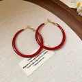 Close-up of glossy Ankara red hoop earrings with retro gold-tone fasteners. - Vintage Simple Hoop (1#) / Dark Red