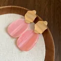 Elegant pink marbled acrylic drop earrings with irregular wavy gold metal stud tops - Irregular Oval Style / Pink
