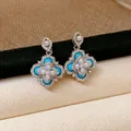 Elegante vintage bloemoorbellen met blauwe stenen en parels in zilveren afwerking - 925 Sterling Zilver Stift - Pavé Zirconia Hemelsblauwe Bloem Oorbelsluiting Stijl (80)
