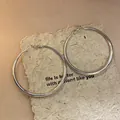 Simple silver large hoop earrings with elegant polished finish on textured background - Large / Simple Round Hoop Style (54#) / Silver