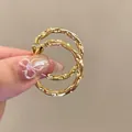 Elegant gold-tone twisted oval hoop earrings featuring a minimalist luxury design for women - Twisted Texture Oval Hoop (58#) / Gold