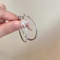 Elegant minimalist silver-plated oval hoop earrings accented with sparkling pave rhinestones - Rhinestone Oval Style (93) / Diameter 38mm / Silver