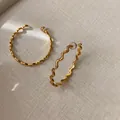 Elegant textured gold wavy hoop earrings with unique irregular hammered finish design - Wave Oval Style (103) / Gold