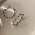 Elegant minimalist silver wavy oval hoop earrings with unique textured metal finish - Wave Textured Hoop Earrings (104#) / Silver