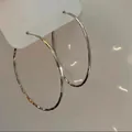 Detailed macro view of large silver hoop earrings with hammered textured finish - Style (1#) / 59mm / Silver