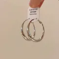 Detail view of high-quality minimalist silver hoop earrings with a polished finish - Style (3#) / Large / Silver