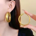 Fashionable chunky gold hoop earrings featuring a mix of matte and polished finishes - Style(48#) / Diameter 51mm / Gold