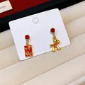 Detailed close-up view of festive red zodiac horse earrings featuring lucky Chinese text tags - Wealthy Success Style (4#) / Gold-Red