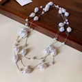 Elegant multi-layer necklace with baroque-style artificial pearls on a fine silver chain - Silver