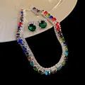 Close-up of a colorful rhinestone necklace and green gemstone earrings jewelry set. - Necklace and Earrings (2-Piece) / Colorful