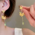 Detailed view of elegant yellow chiffon flower earrings with a green crystal drop - Silver Post Style 6#